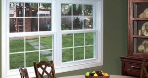 The interior of two side-by-side boule hung vinyl windows in a kitchen.