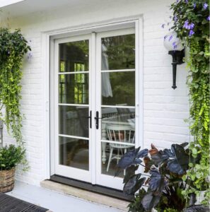 White entry door with windows on white home
